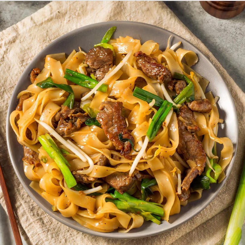 Crystal Garden's beef chow fun with wide noodles, green onions, and bean sprouts.